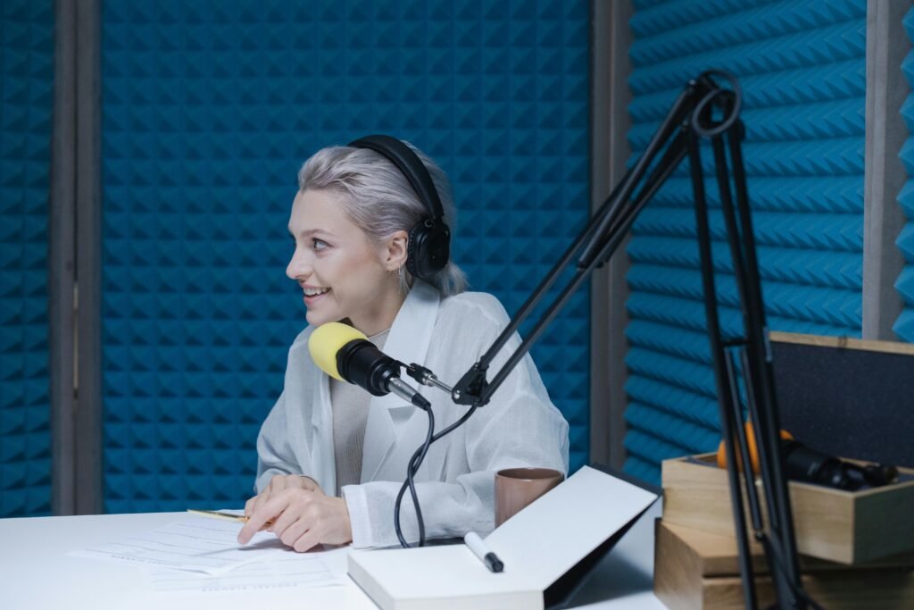 Woman speaking in a podcast studio