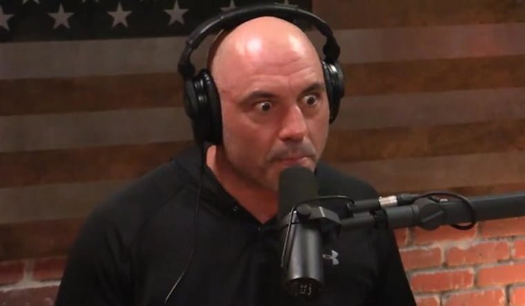 Image of a Joe Rogan speaking into a microphone on a podcast