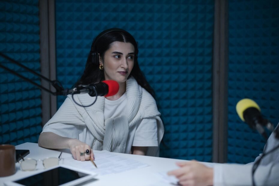 two women discussing content during a podcast recording