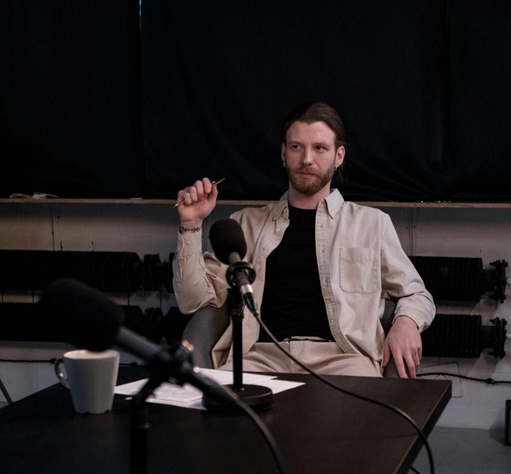 Image of a man with studio microphone on a stand