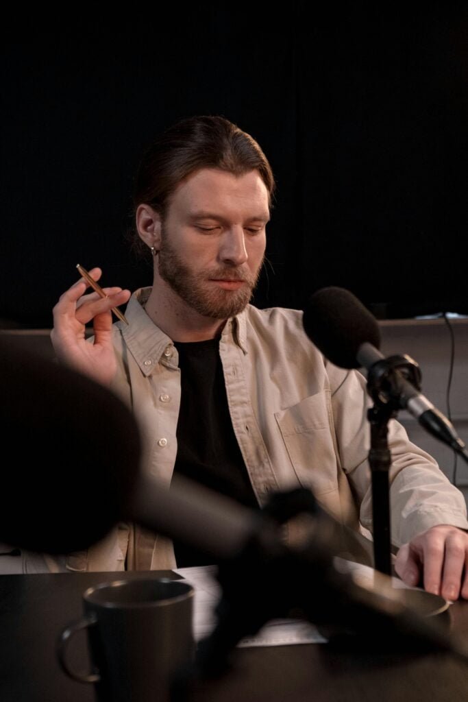 man recording a podcast in a professional studio setup