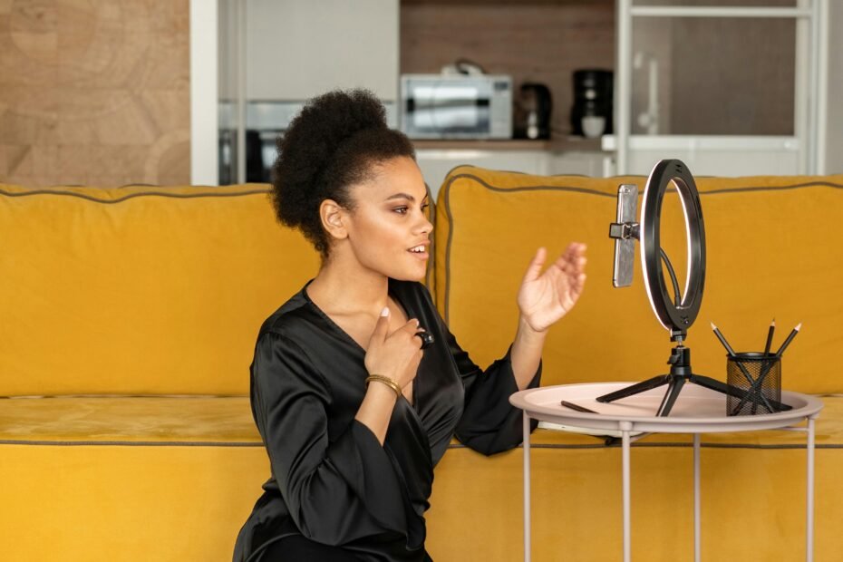 woman creating YouTube content with camera and ring light